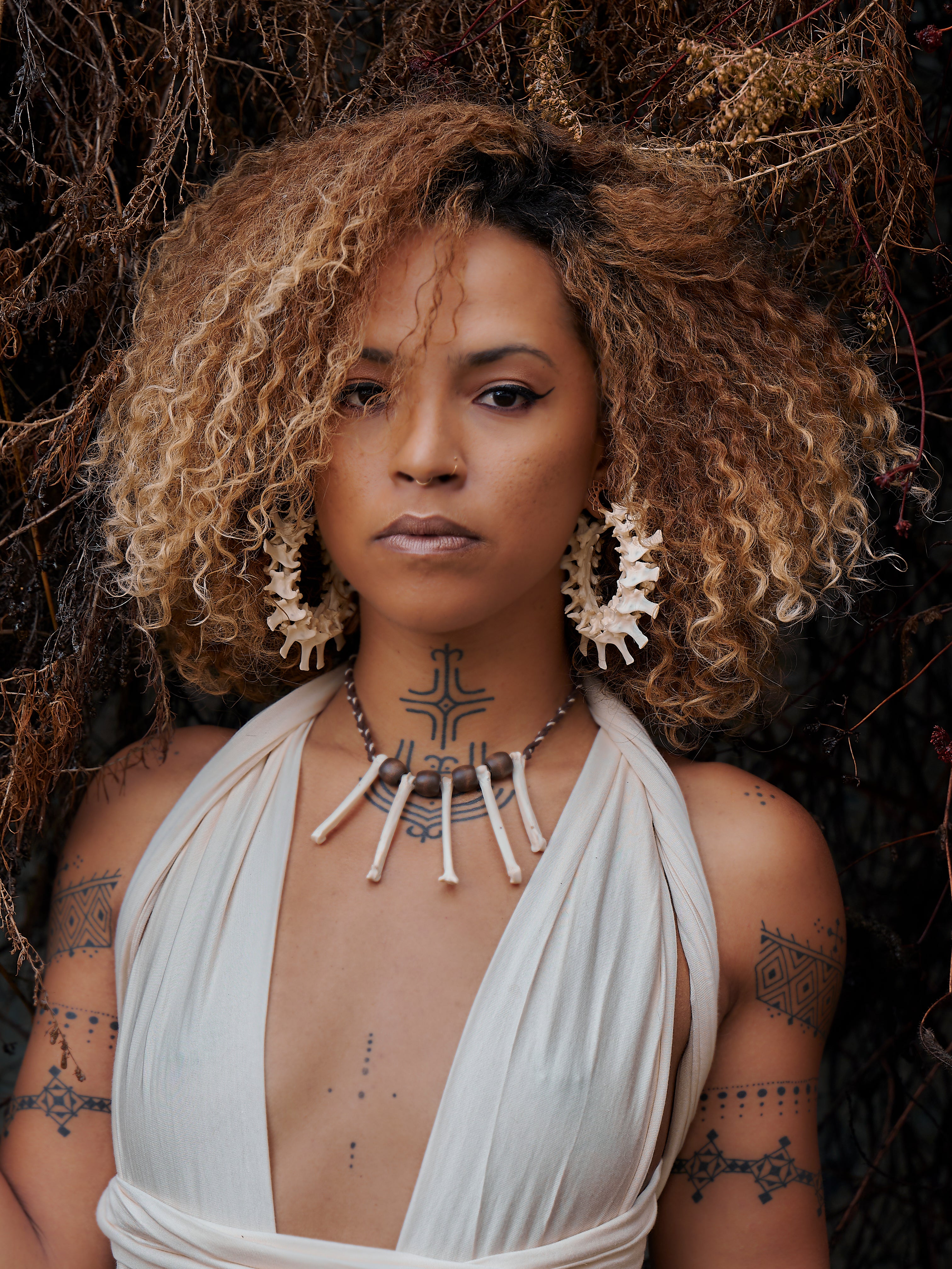 real bone jewelry, model wearing snake vertebrae bone earrings, snake earrings, snake bone earring, snake bone earrings, bone choker, bone art