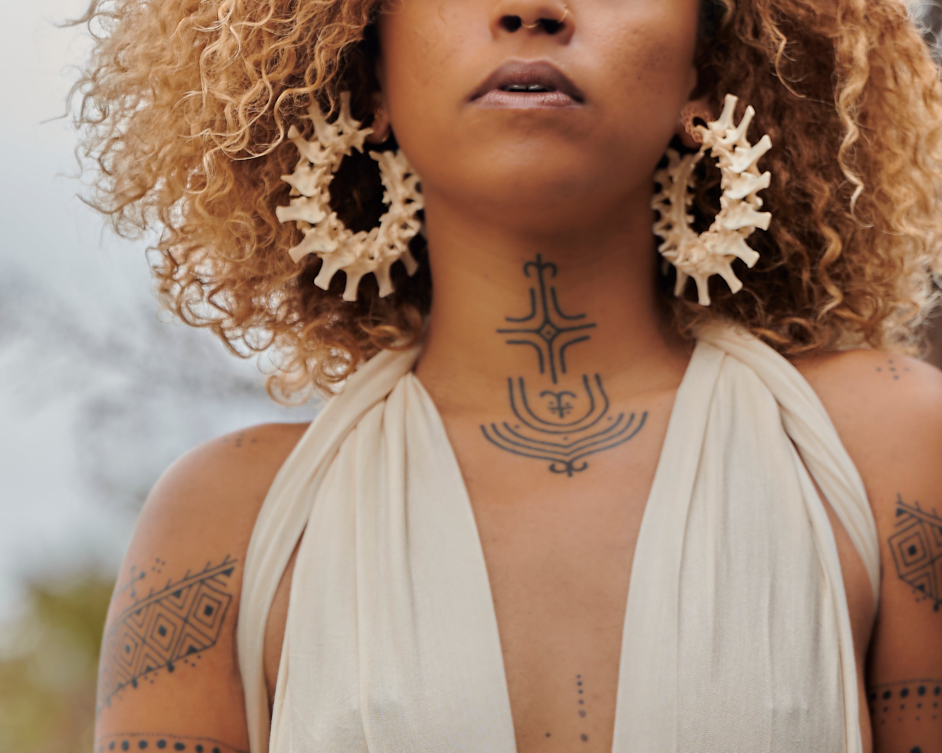 real bone jewelry, model wearing snake vertebrae bone earrings, snake earrings, snake bone earring, snake bone earrings, bone art