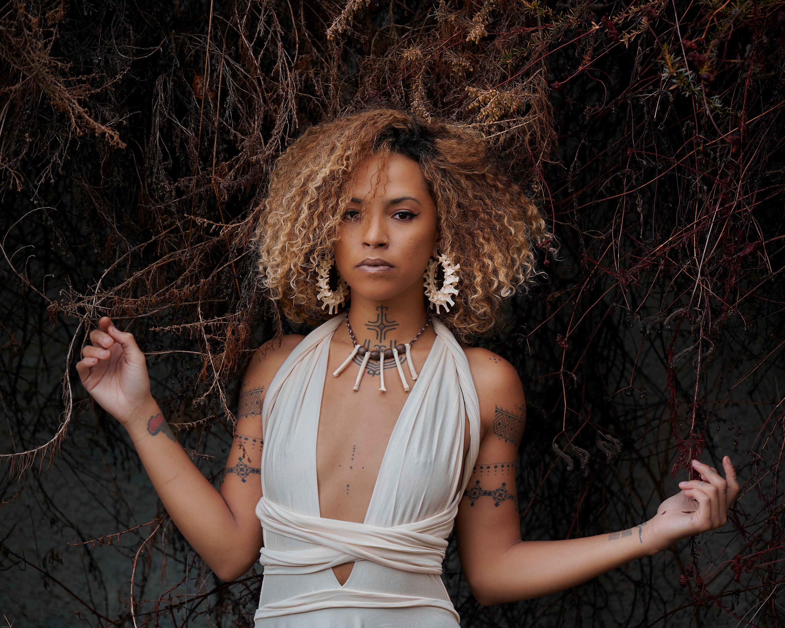 real bone jewelry, model wearing snake vertebrae bone earrings, snake earrings, snake bone earring, snake bone earrings, bone choker, bone art