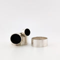 Two silver rings with black accents on a white background